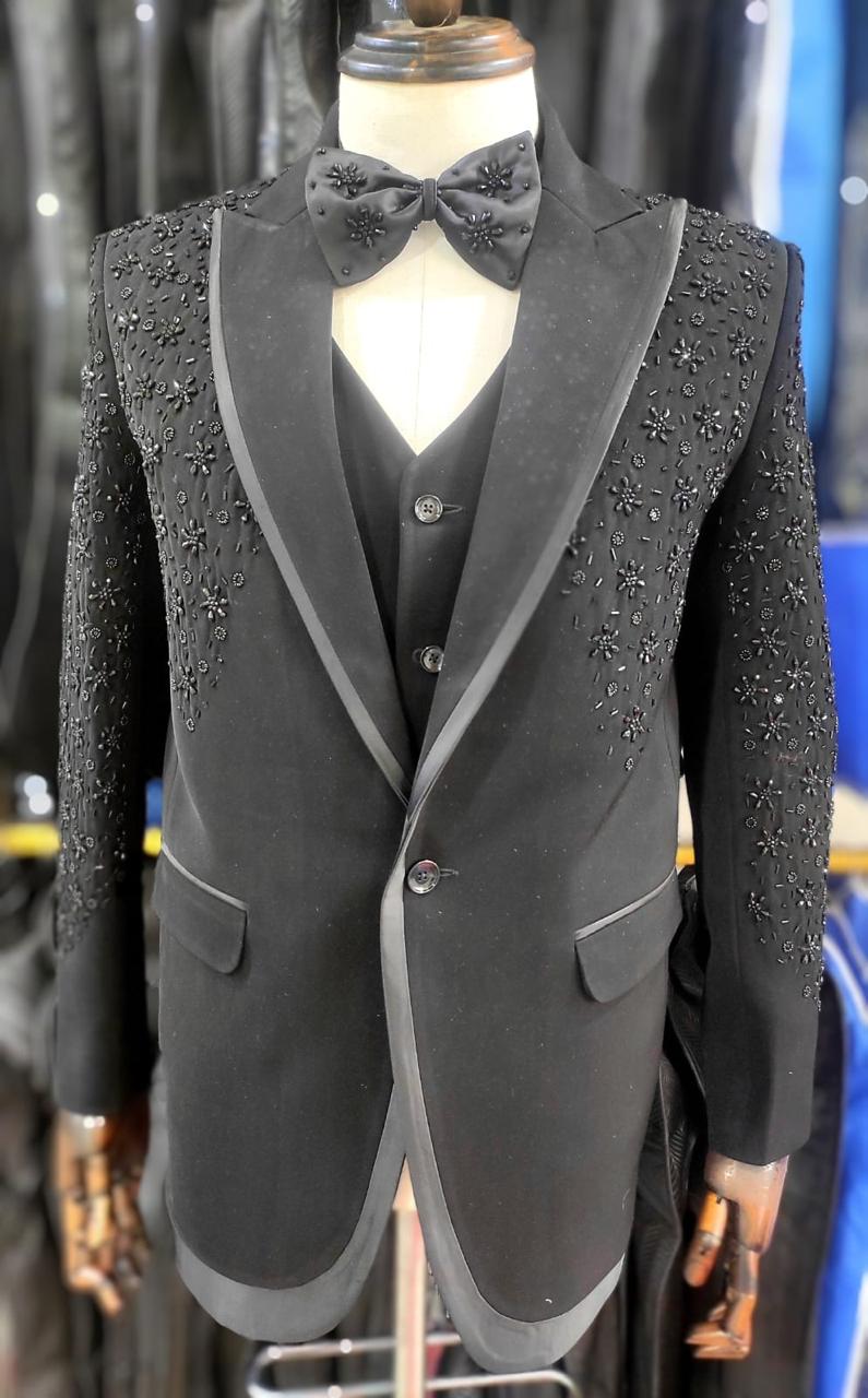 Black tuxedo with satin trim and floral beadwork on the shoulder