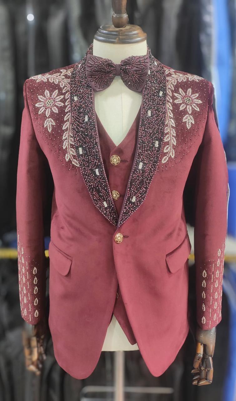 Maroon velvet suit with floral beadwork on the collar and shoulder